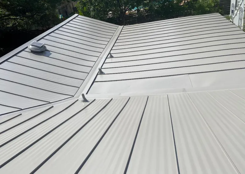 Solar attic fan installed on a metal roof for Roof Ventilation in Mount Dora